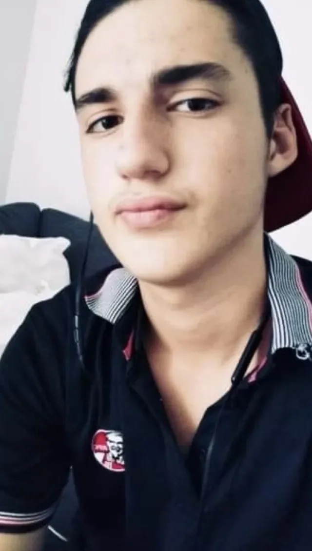 Jayden at 17 in his KFC uniform, backwards cap and all